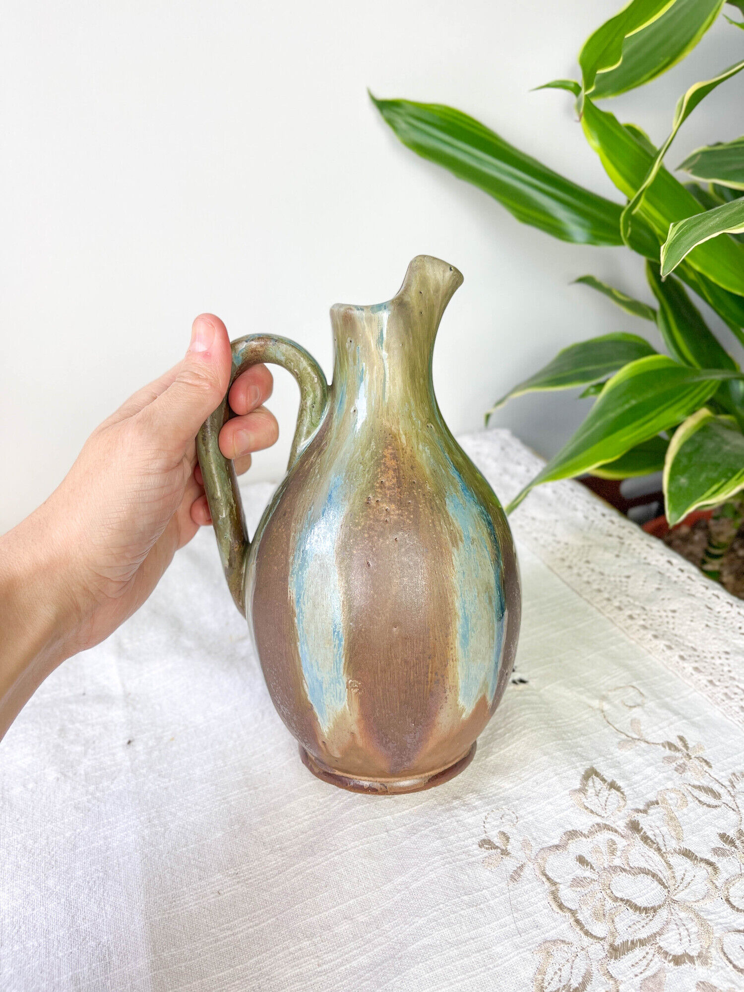 Art Nouveau style carafe in flamed stoneware with blue and brown drips