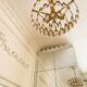 Vintage chandelier in gilded brass with crystal pendants.