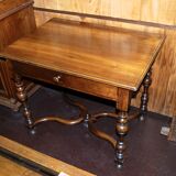 Louis XIII writing table in walnut, turned baluster x-shaped legs.