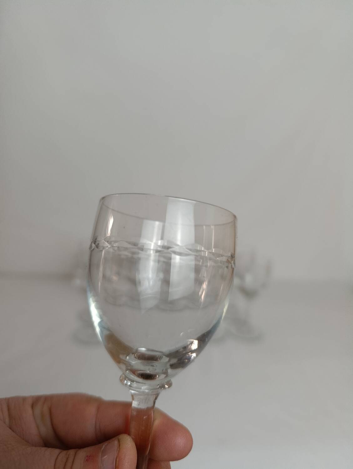 Set of 11 antique engraved crystal liqueur glasses.