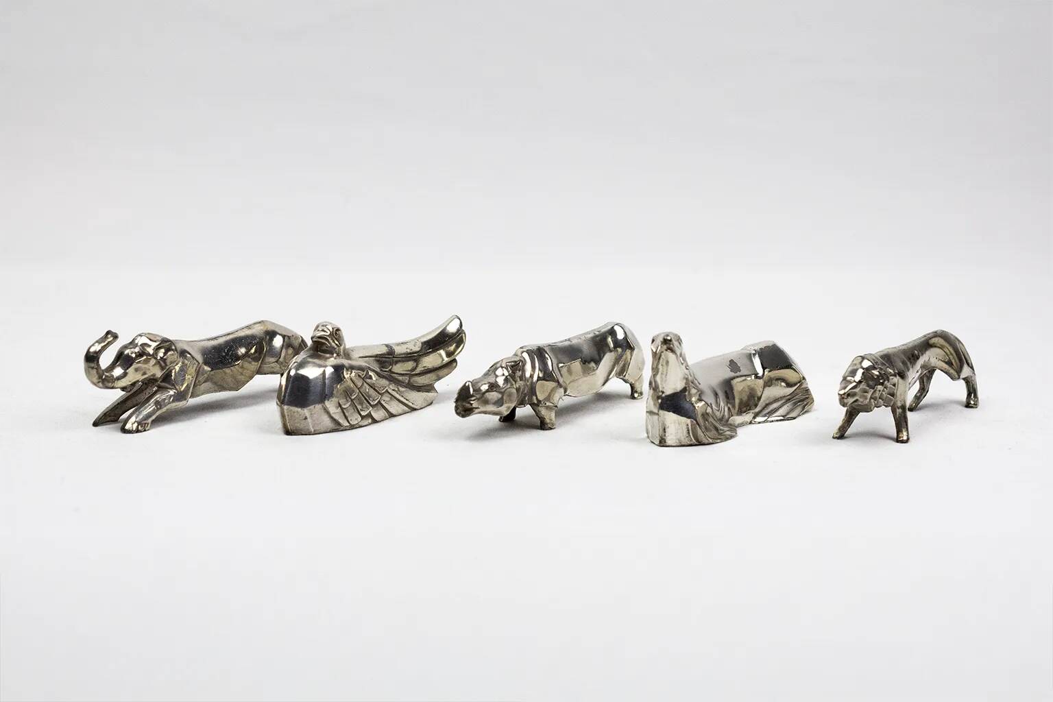 10 porte-couteaux animaliers Art déco en métal argenté – dlg Sandoz, Gallia