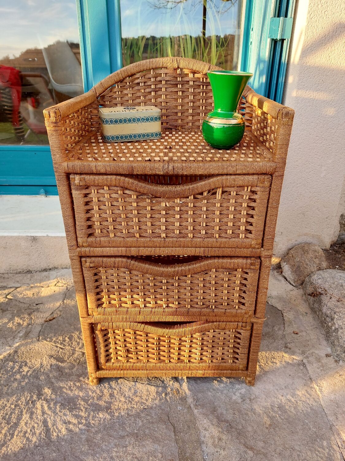 Wicker chest of drawers and rope