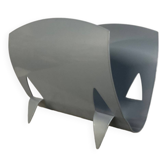 Designer log holder in enameled sheet metal