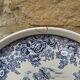 Old ceramic plate with scene of life and blue floral decor Van Melle