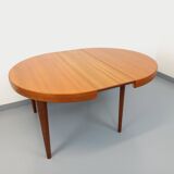 Large vintage Scandinavian round table from the 50s 60s in teak with extensions