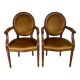 Paire de fauteuils médaillon en bois et velours