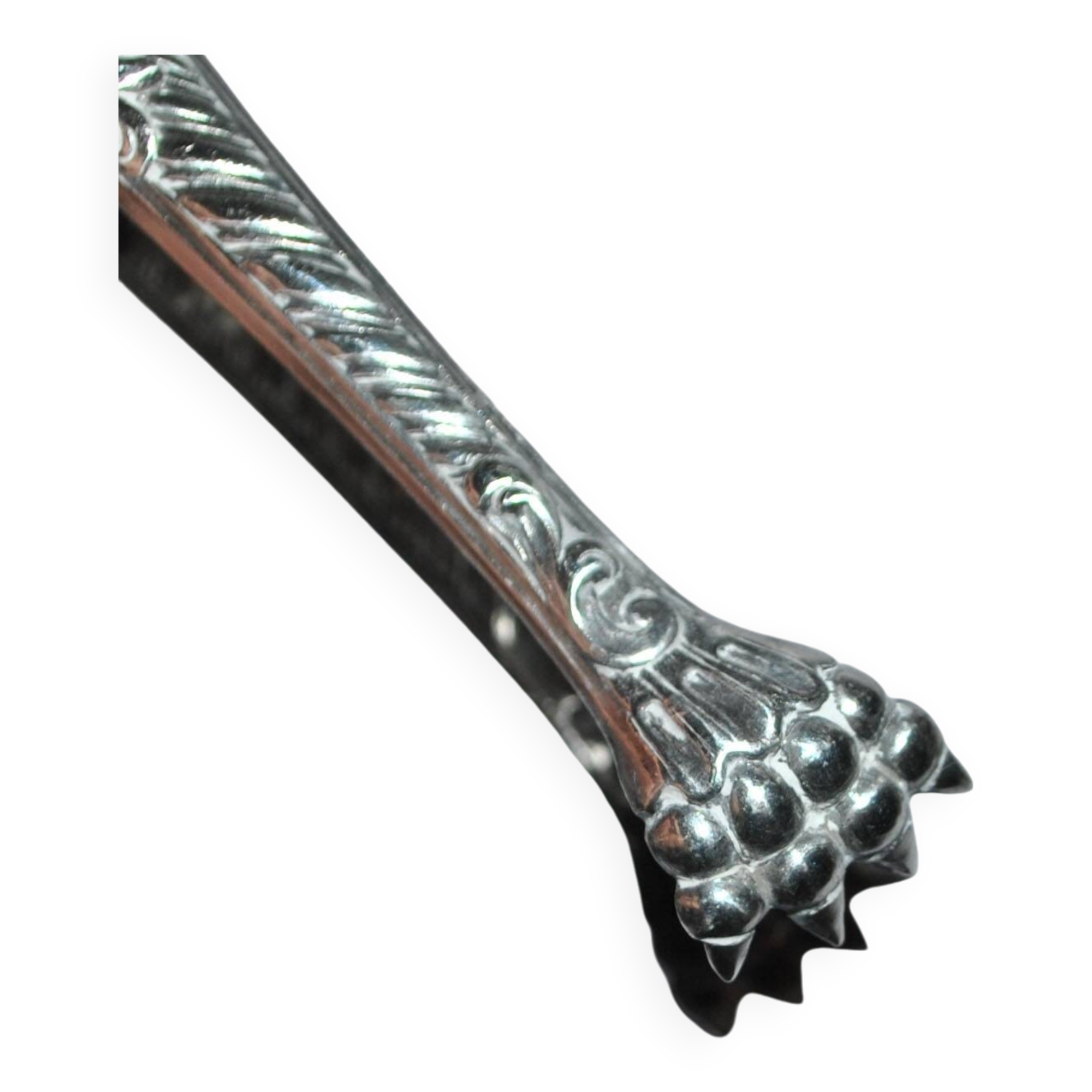 Rocaille sugar tongs in silver metal with lion claw medallion