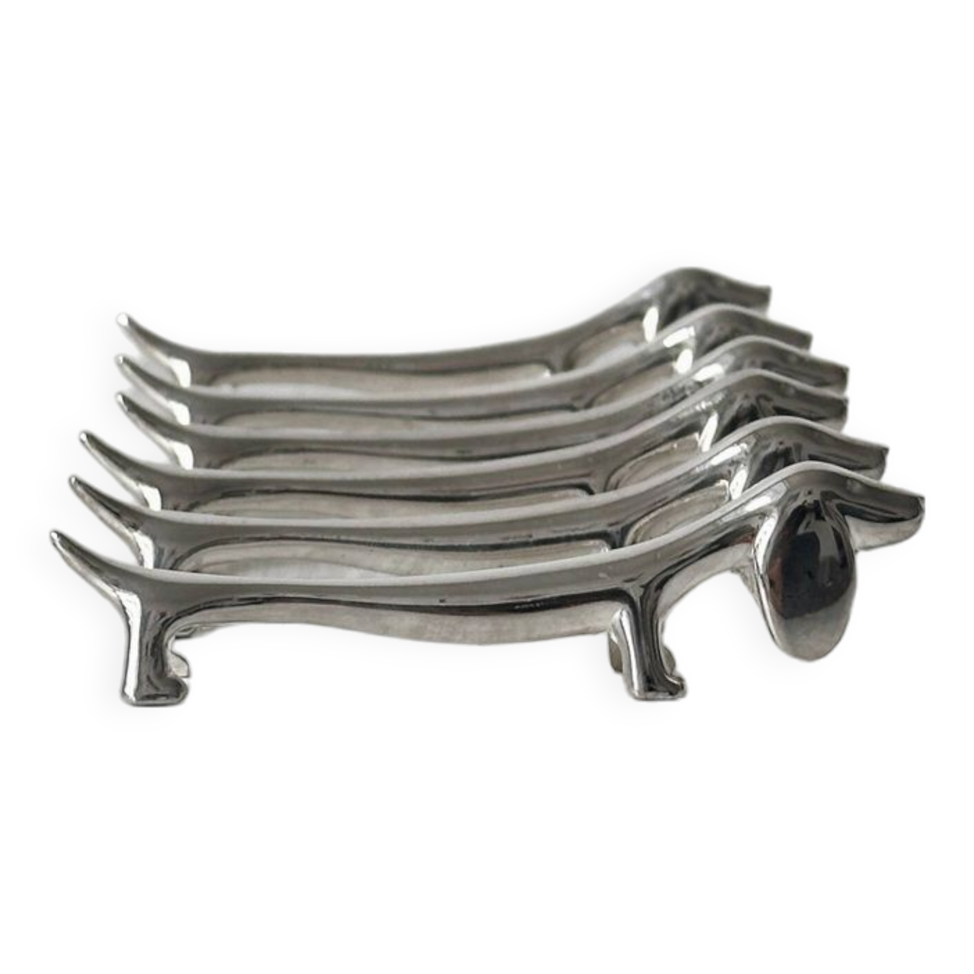 Metal dachshund dog knife holder.