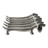 Metal dachshund dog knife holder.