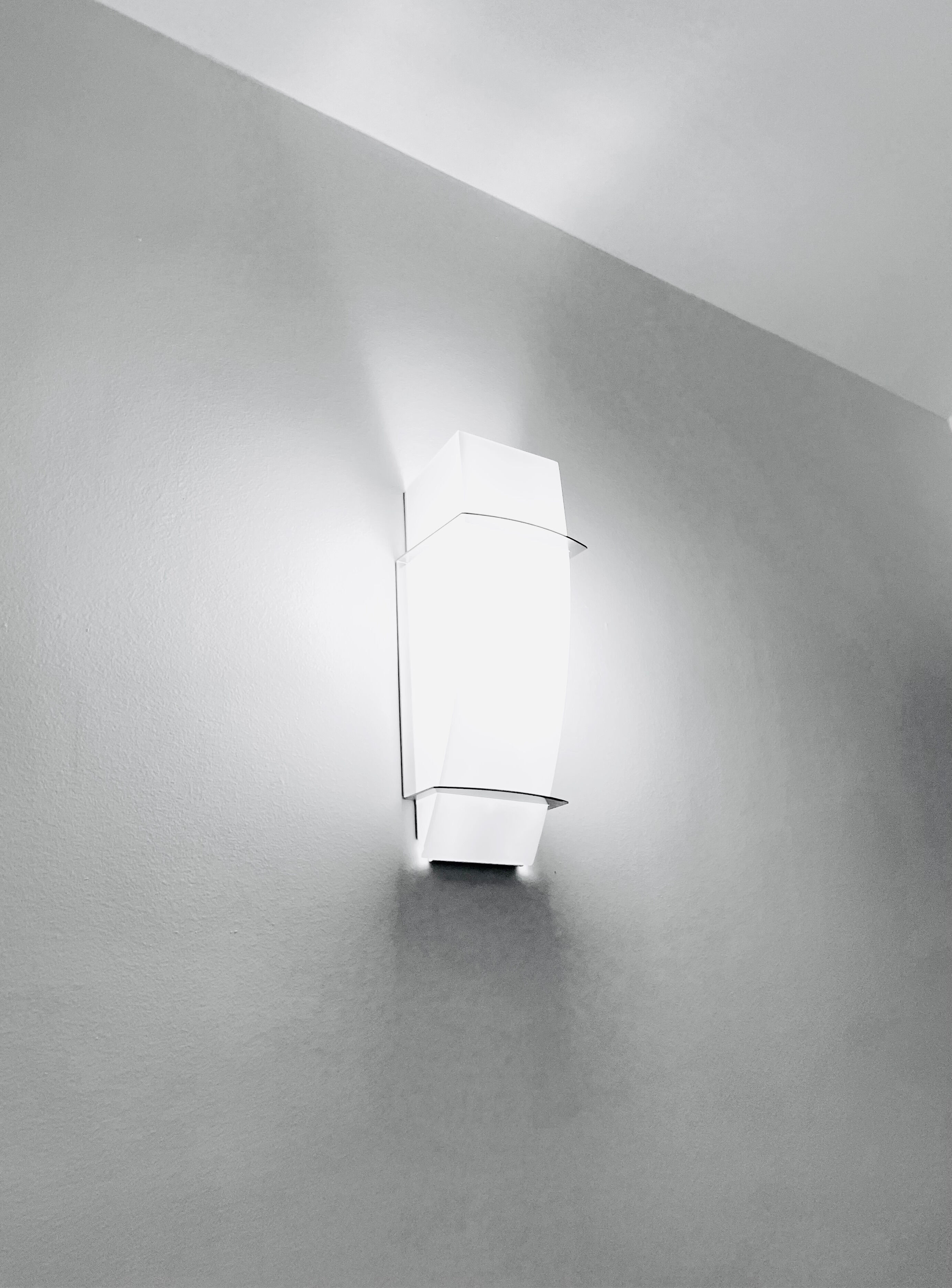 Wall lamp in satin glass and nickel-plated metal designed by Leonardo Marelli