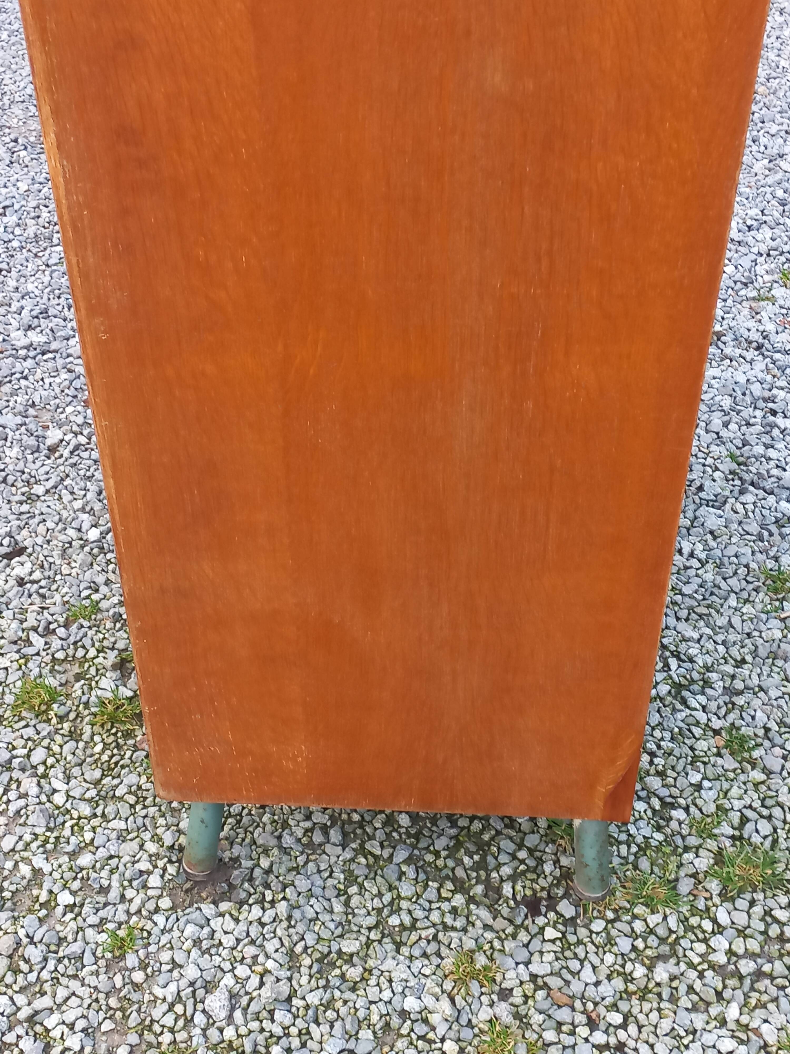 Vintage oak wardrobe with metal legs from the 1950s.