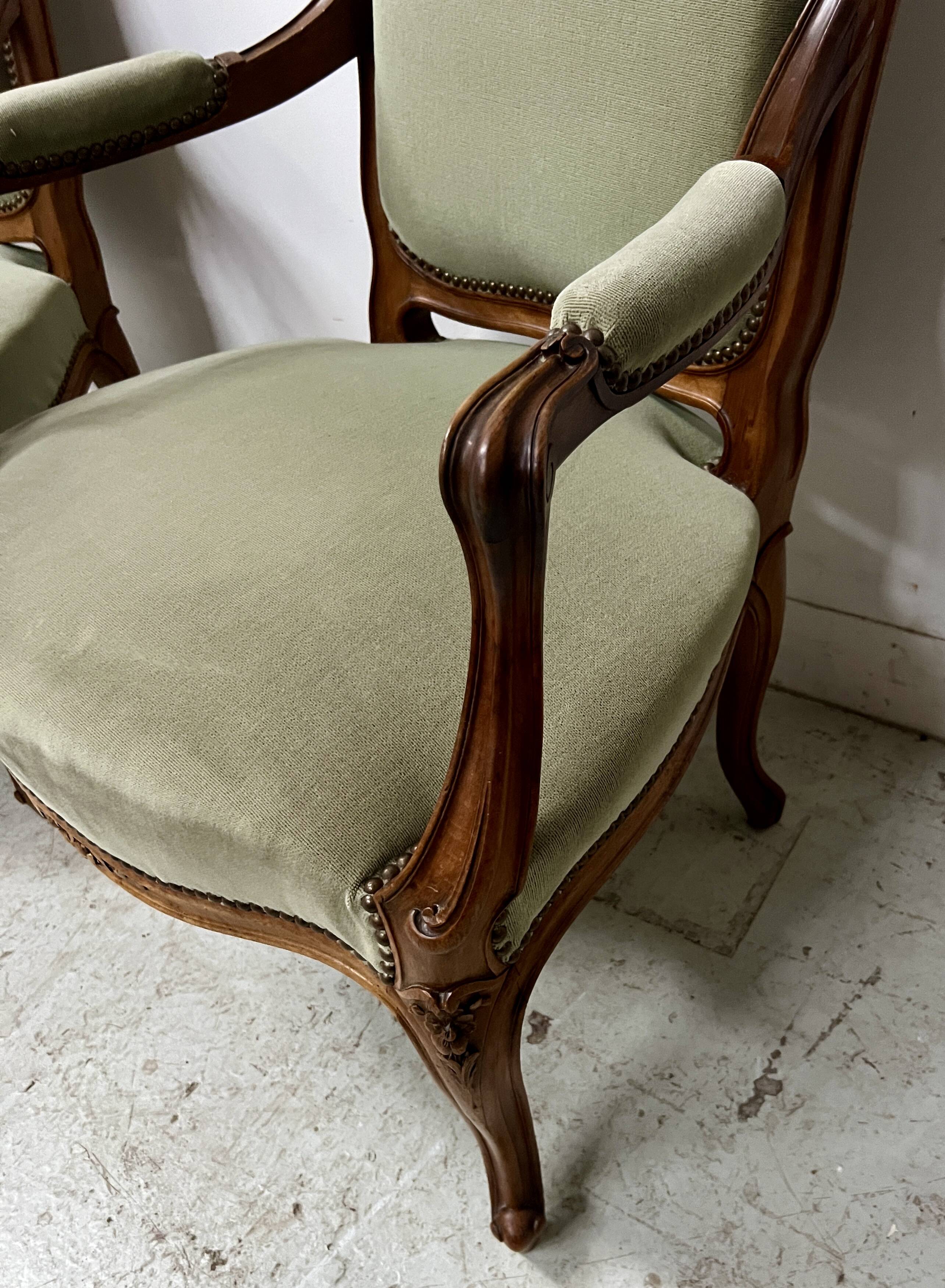 Pair of Louis XV style armchairs in solid walnut, 20th century.
