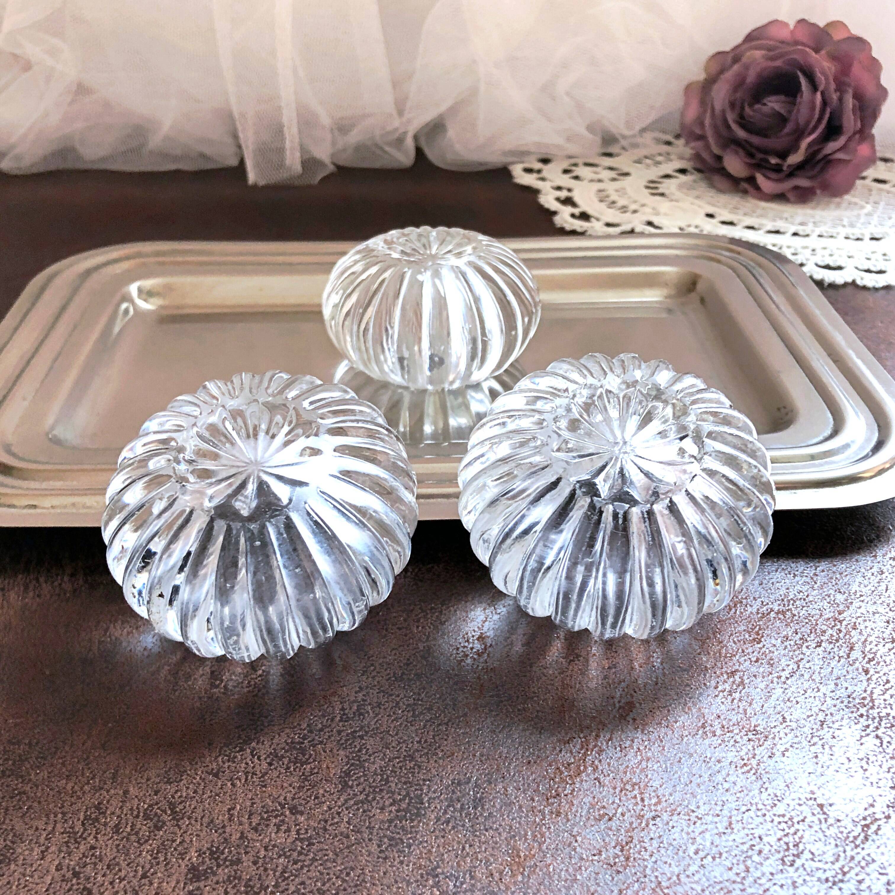 Trio of salt shakers, pepper shakers, molded glass salt shakers