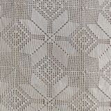 White cotton bedspread, crocheted sofa throw with star patterns