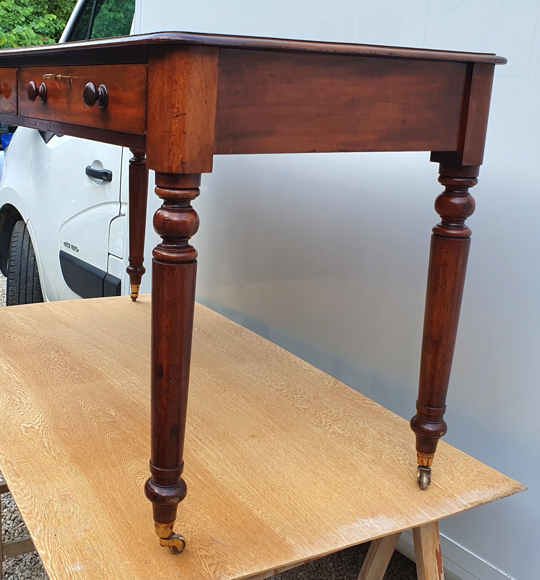 English desk with 2 drawers on green leather