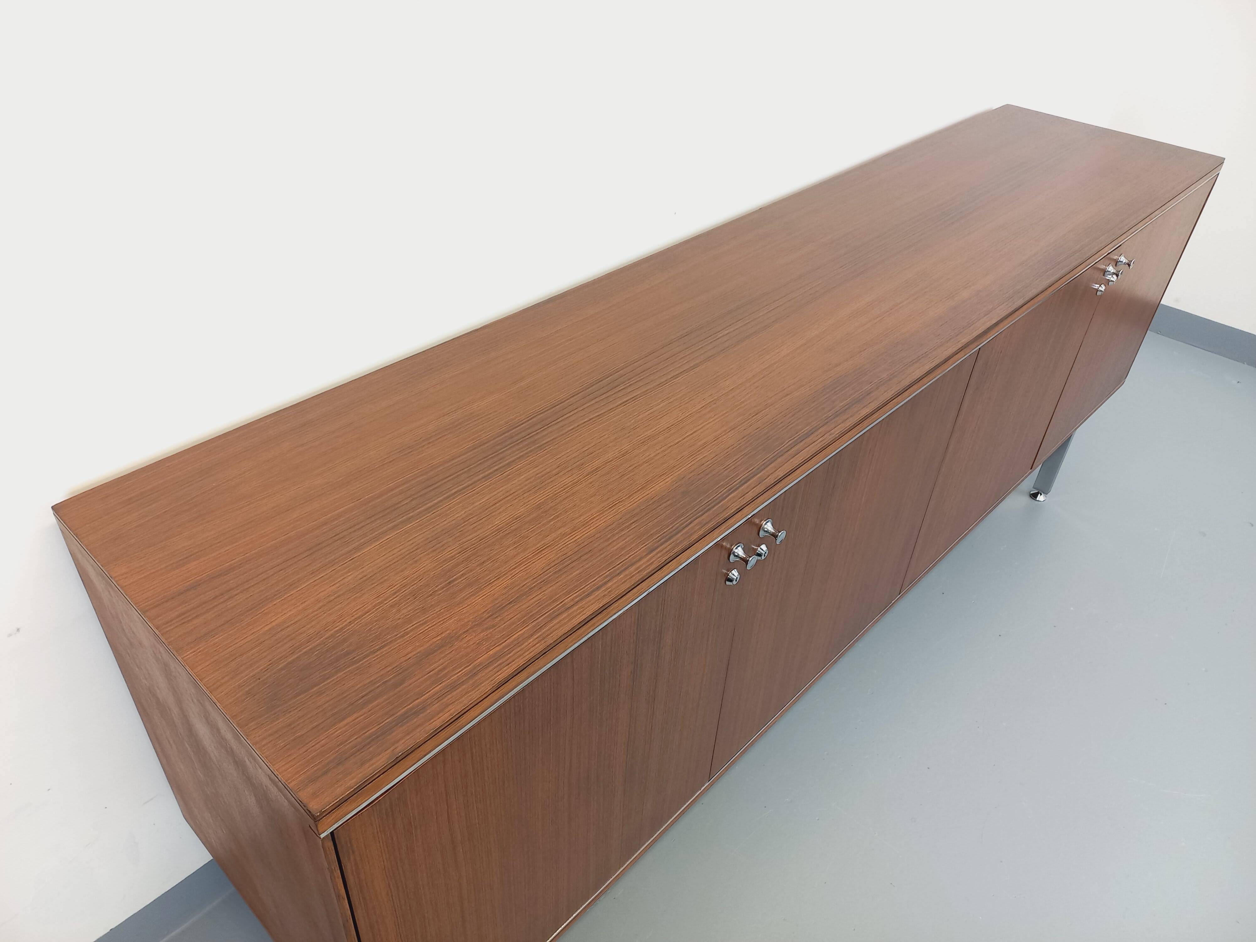 Vintage modernist enfilade in rosewood and chrome metal from the 60s and 70s.