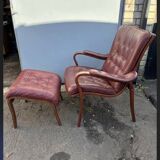 Scandinavian armchair with footrest