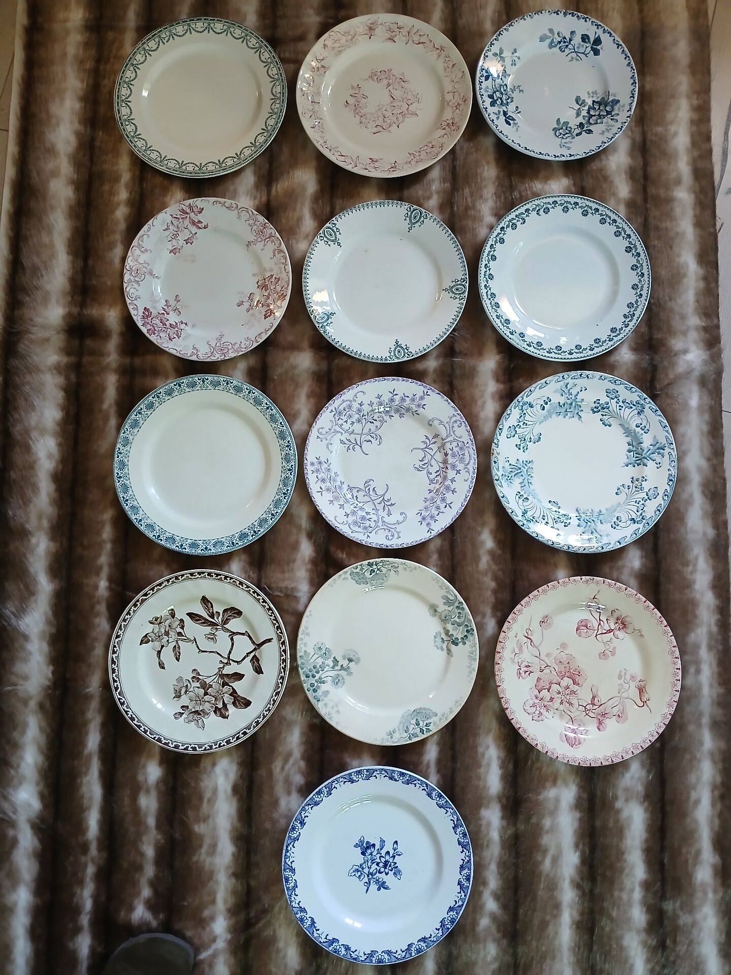 13 mismatched flat plates in ironstone
