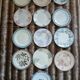 13 mismatched flat plates in ironstone