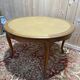 Round oak dining table with leather in Louis XV style.