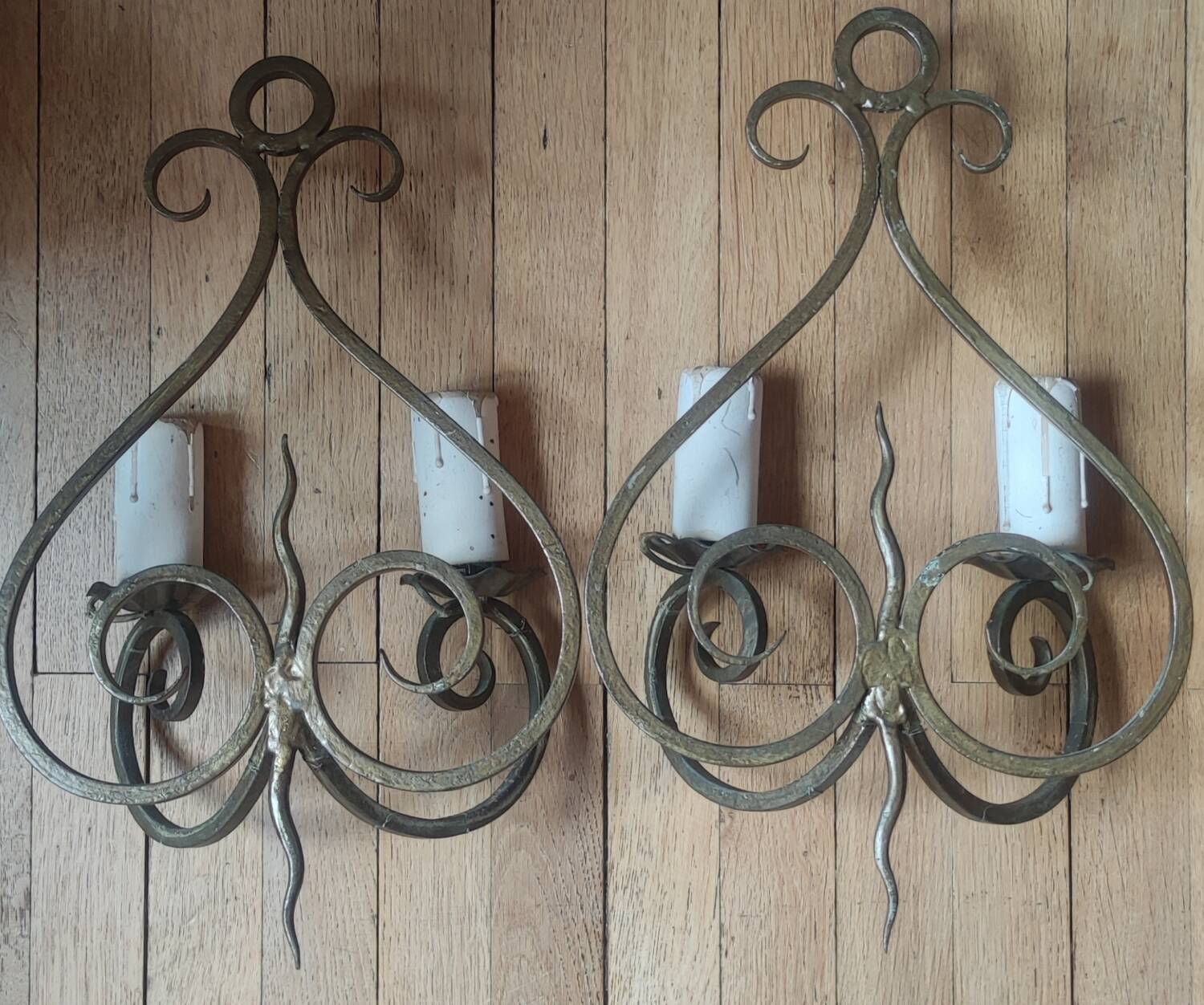 Old pair of wrought iron wall lights