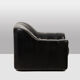 Maison De Sede. Armchair and its ottoman in black leather. 1970s.