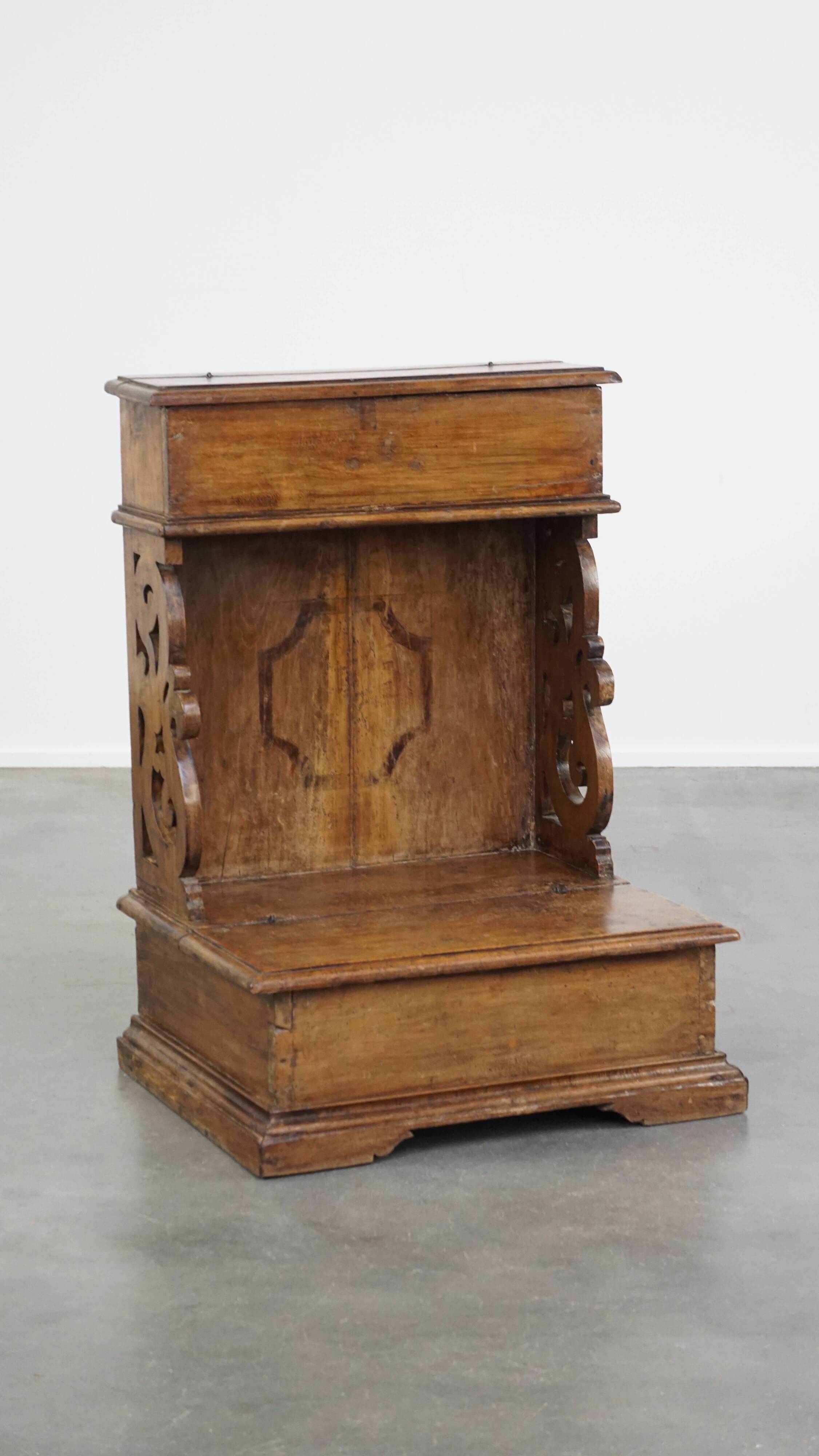 Antique pinewood church pew with storage compartments from the 18th century