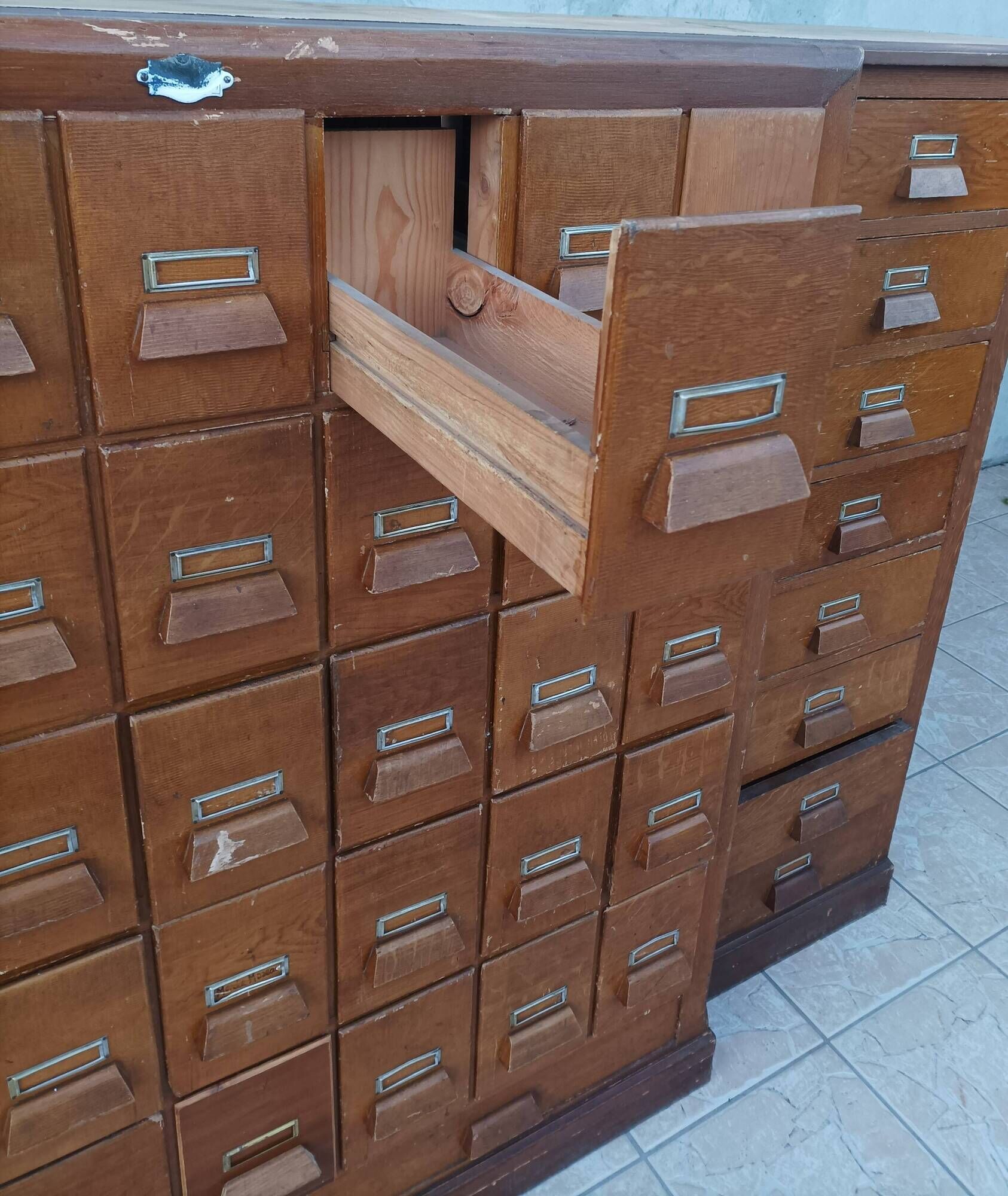 Apothecary or trade cabinet in fir with 53 drawers.