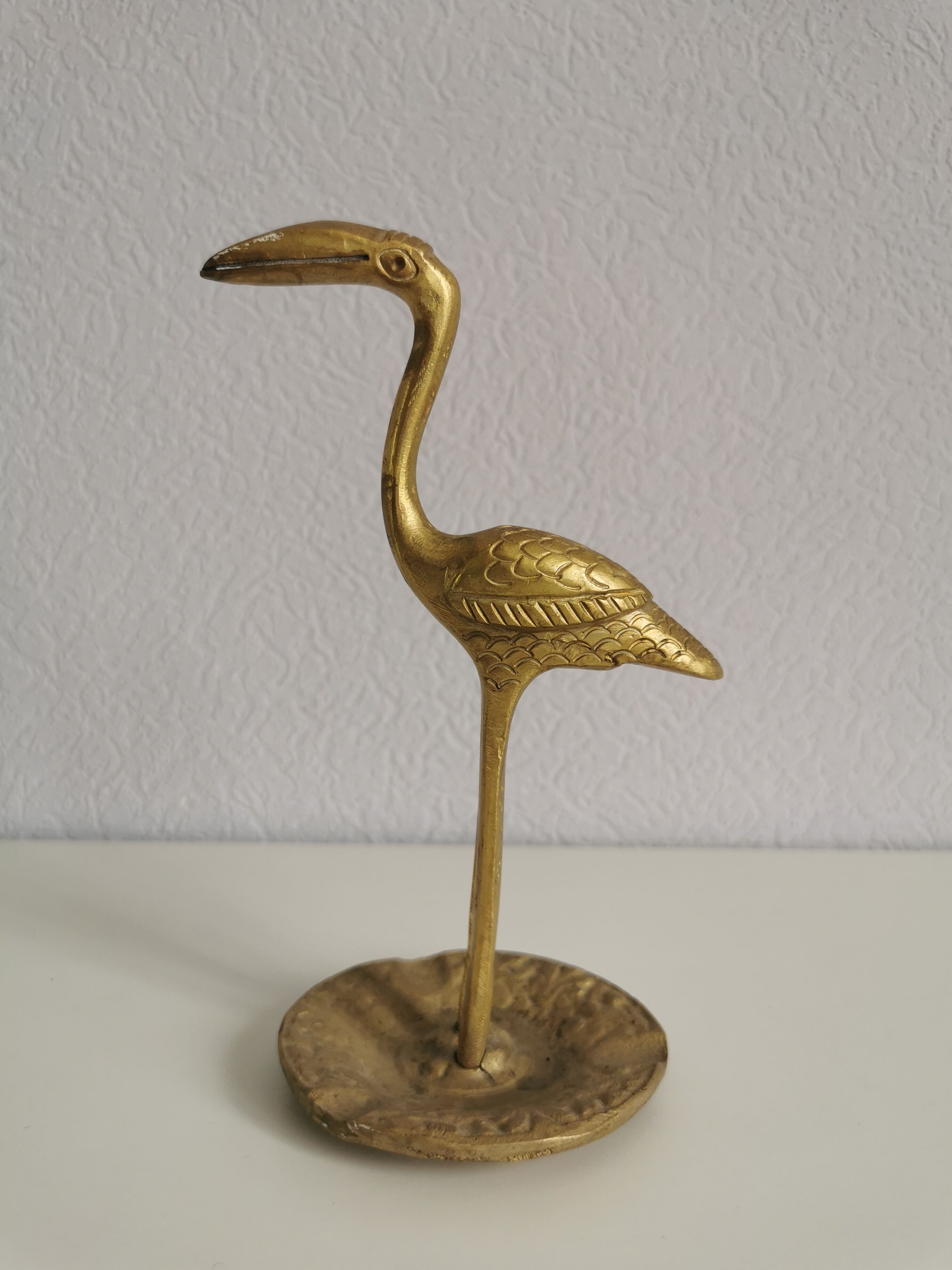 Naif brass bird