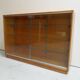 Vintage shop display cabinet with sliding doors