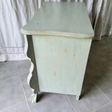Curved patinated chest of drawers