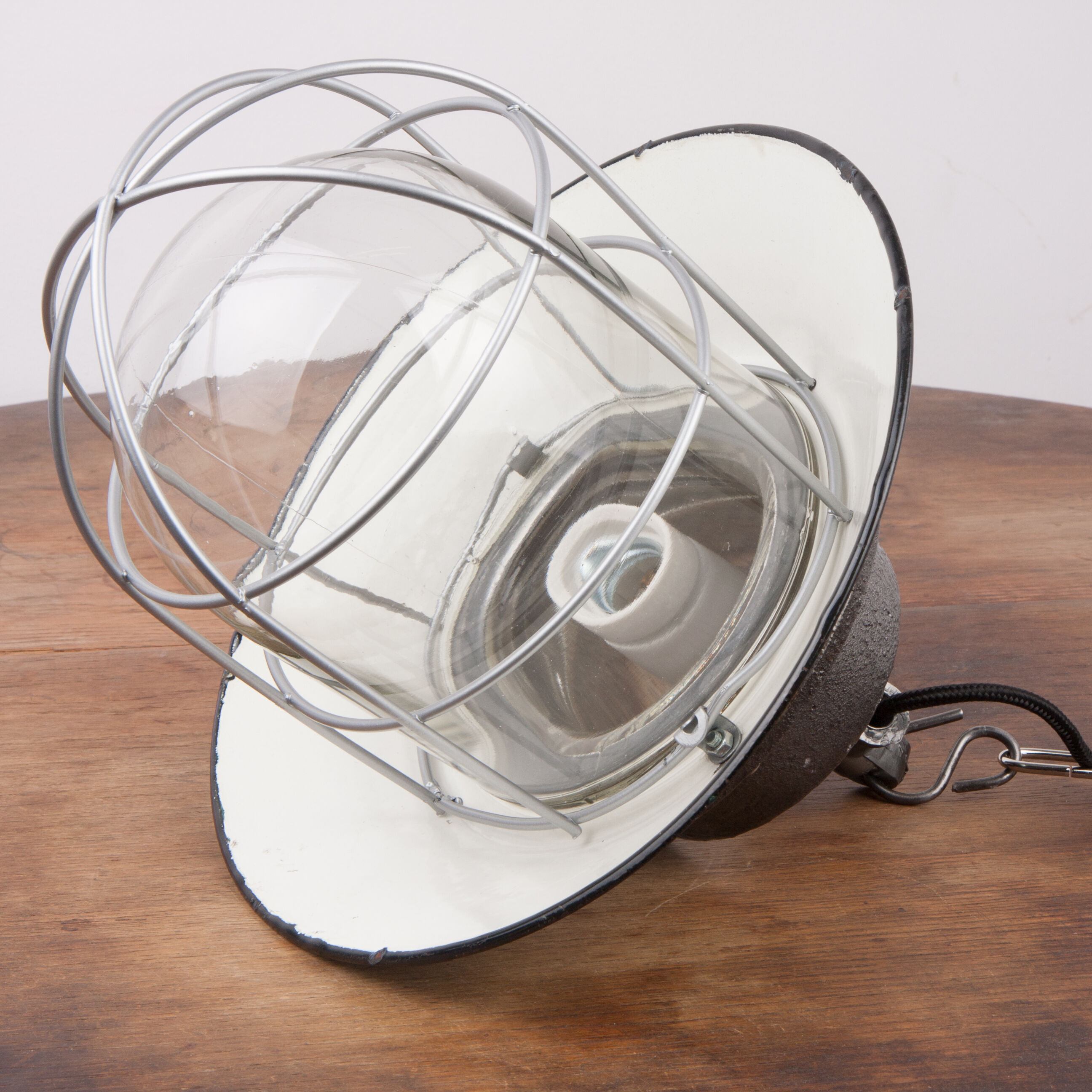 Industrial enamel lamp with glass and cast iron, opal  green, Poland, 1960s