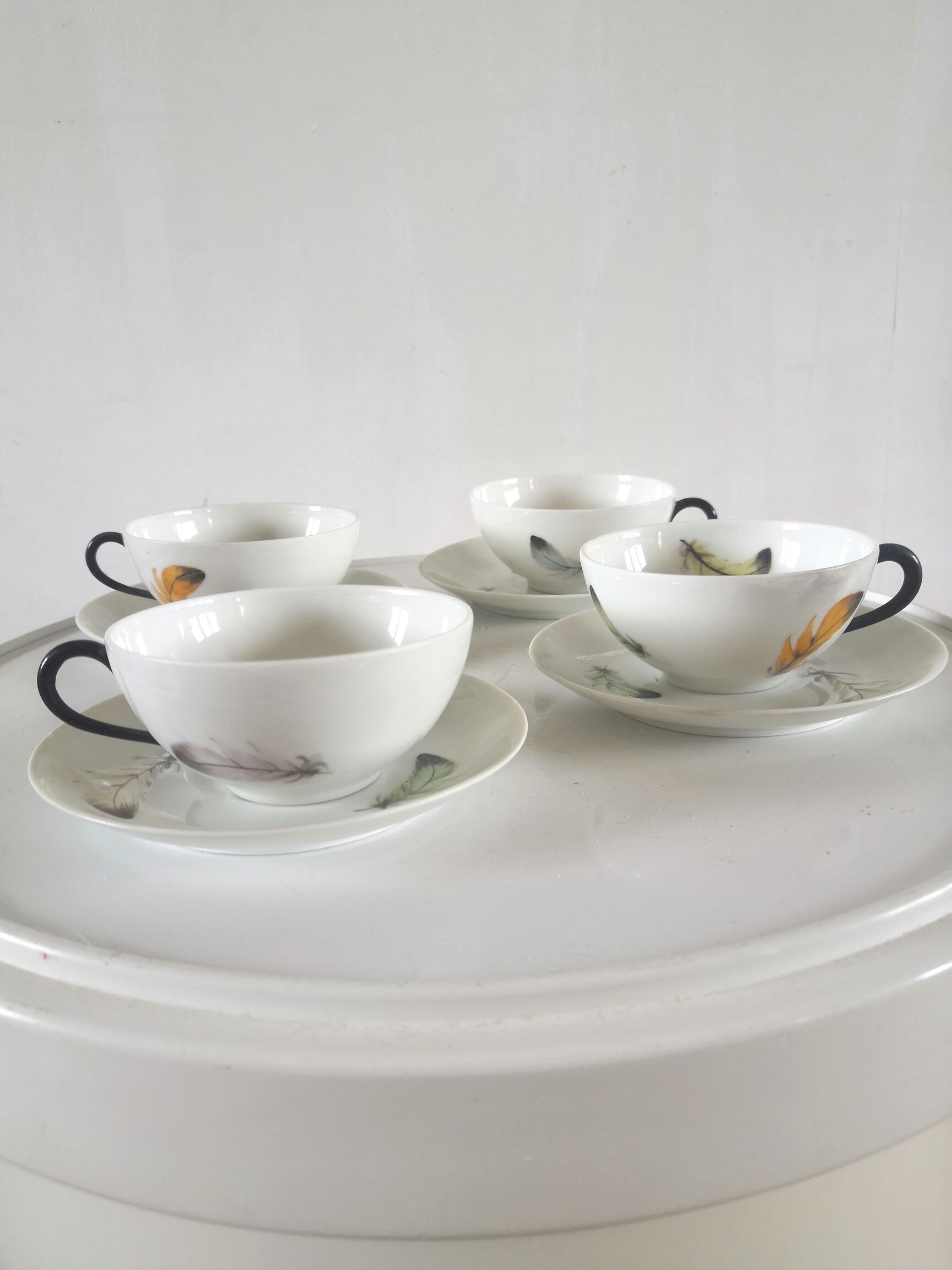 4 cups and cups in fine Limoges porcelain signed LC 60s