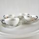4 cups and cups in fine Limoges porcelain signed LC 60s