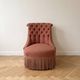 Vintage tufted armchair in old rose fabric.