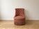 Vintage tufted armchair in old rose fabric.