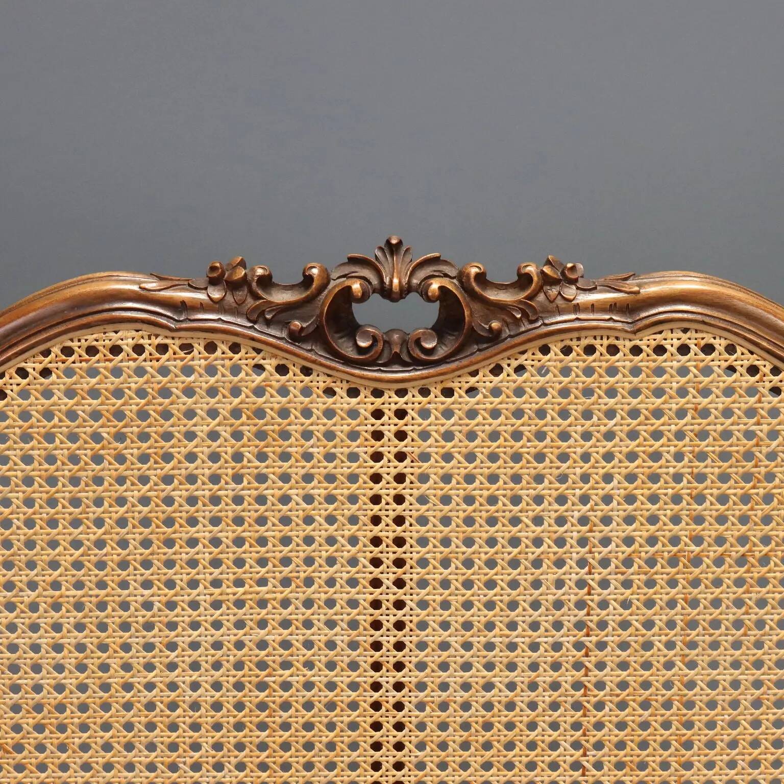 Simple bed in Barocchetto style in walnut.