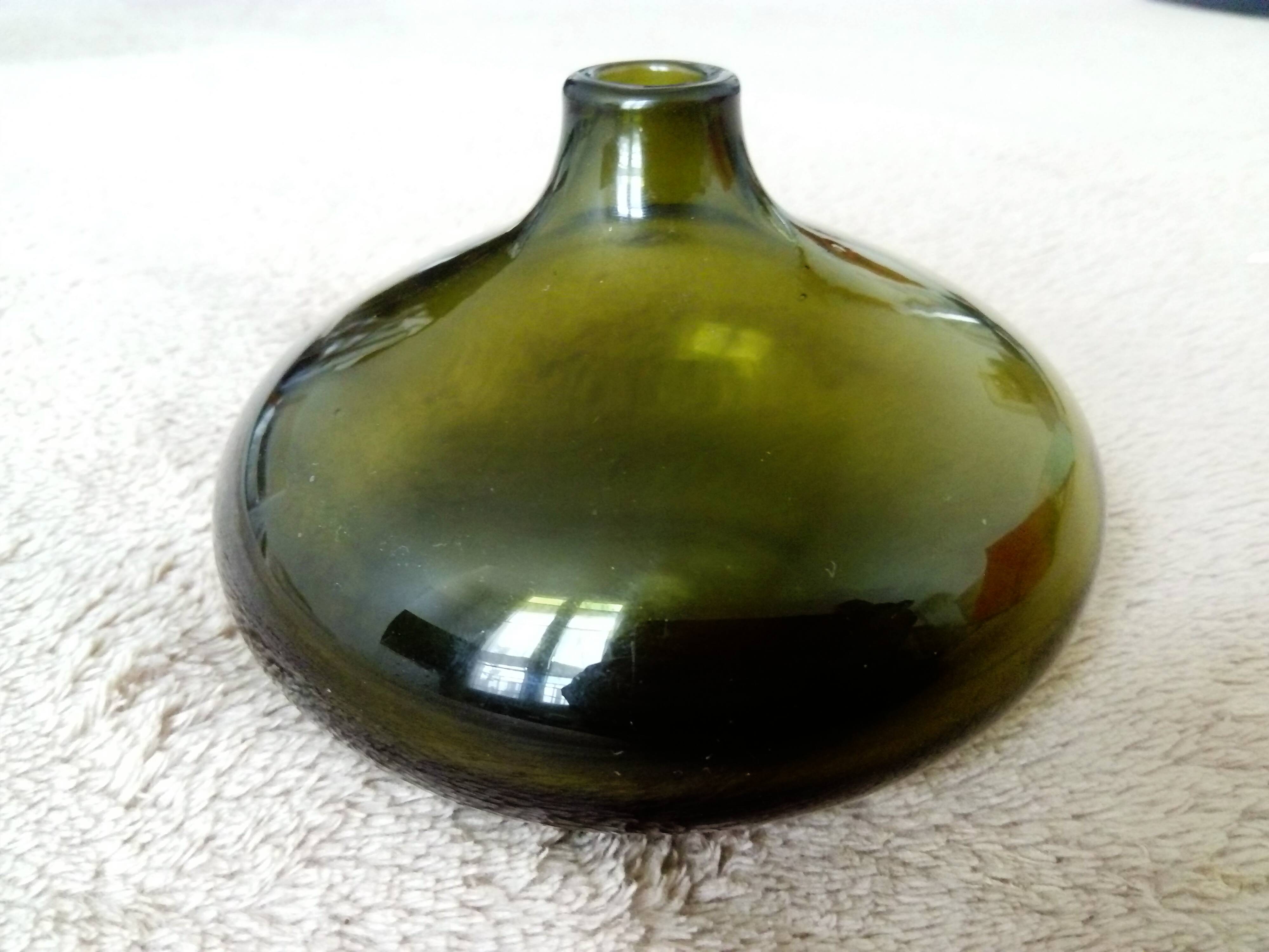 Small dark green handmade glass ball vase