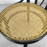 Black canned bistro chairs