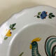Pair of plates with naive Eastern rooster decoration