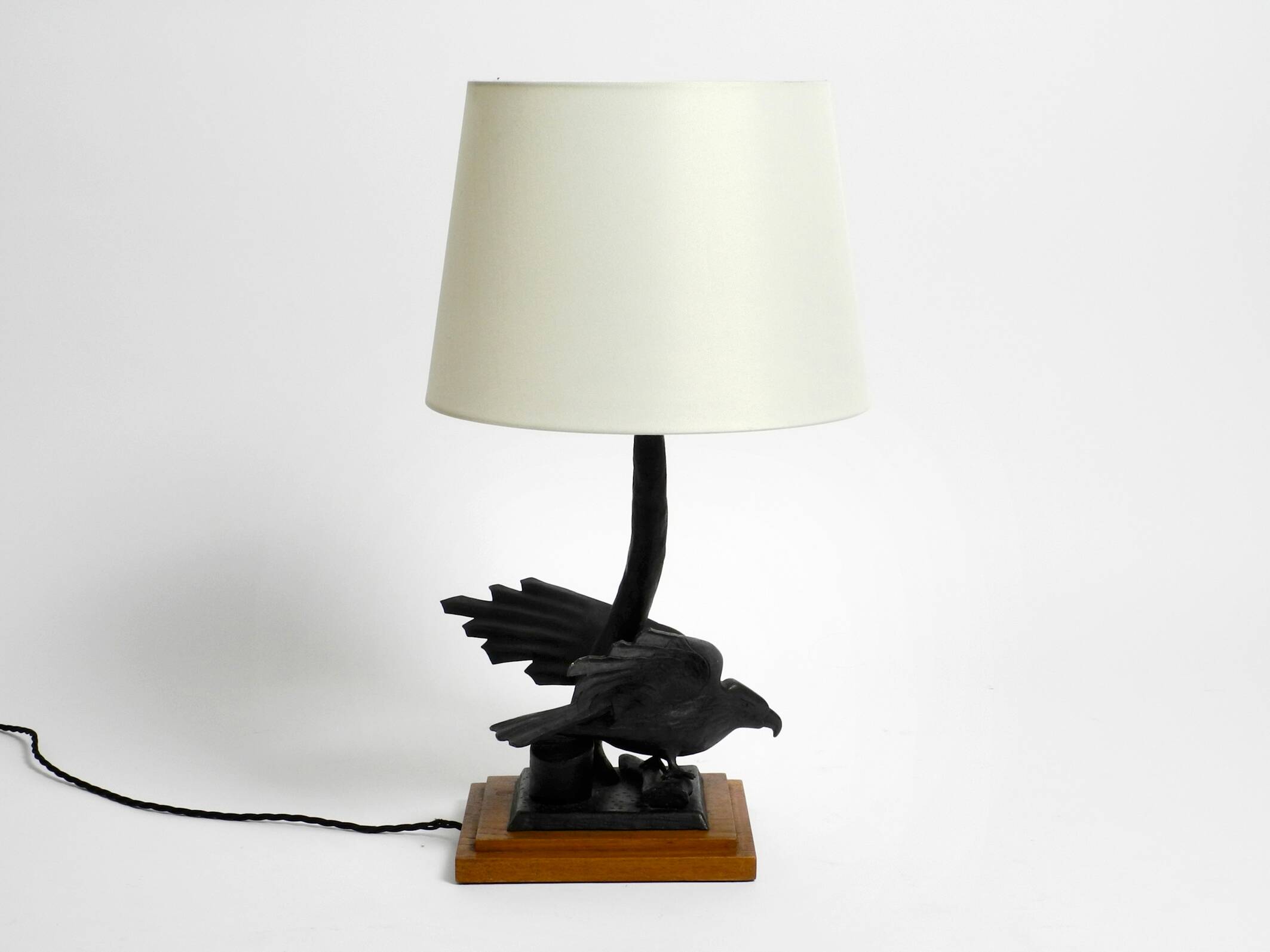 1940s table lamp made of iron in the shape of an eagle, teak wooden base