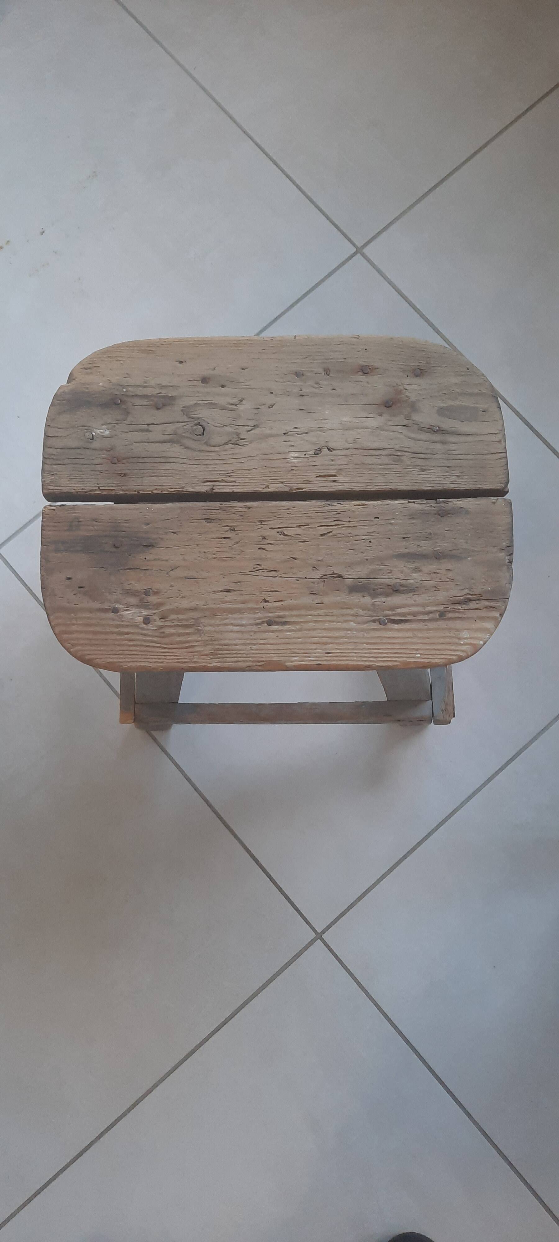 Antique wooden stool in the brutalist style