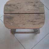Antique wooden stool in the brutalist style