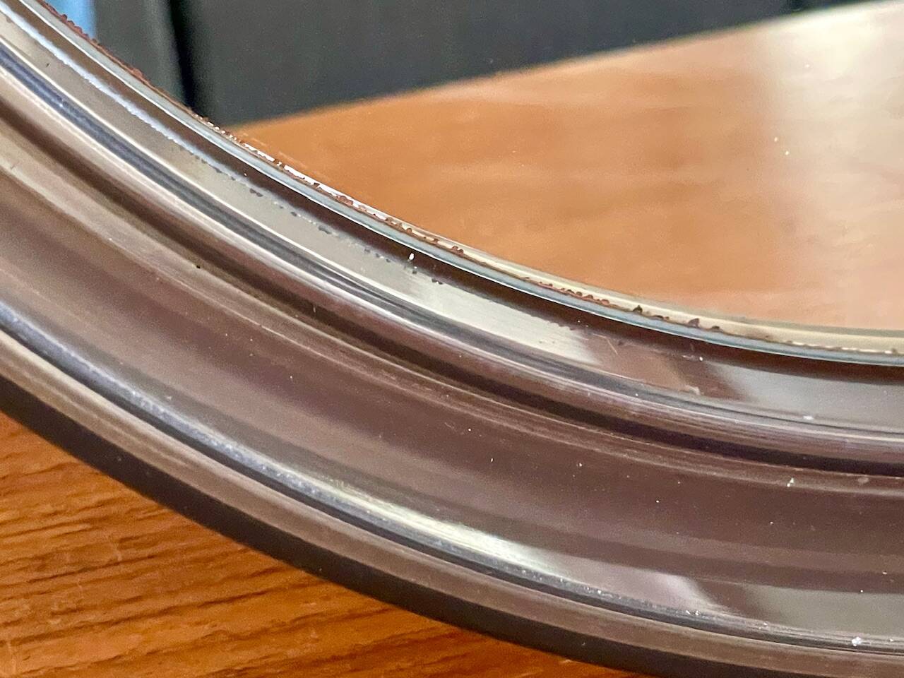 Vintage round smoked plastic mirror, circa 1970s.