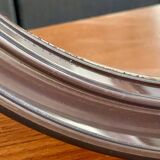 Vintage round smoked plastic mirror, circa 1970s.