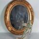 Antique oval mirror with original stucco and gilt wood frame, 37x31 cm. Beautiful patina.