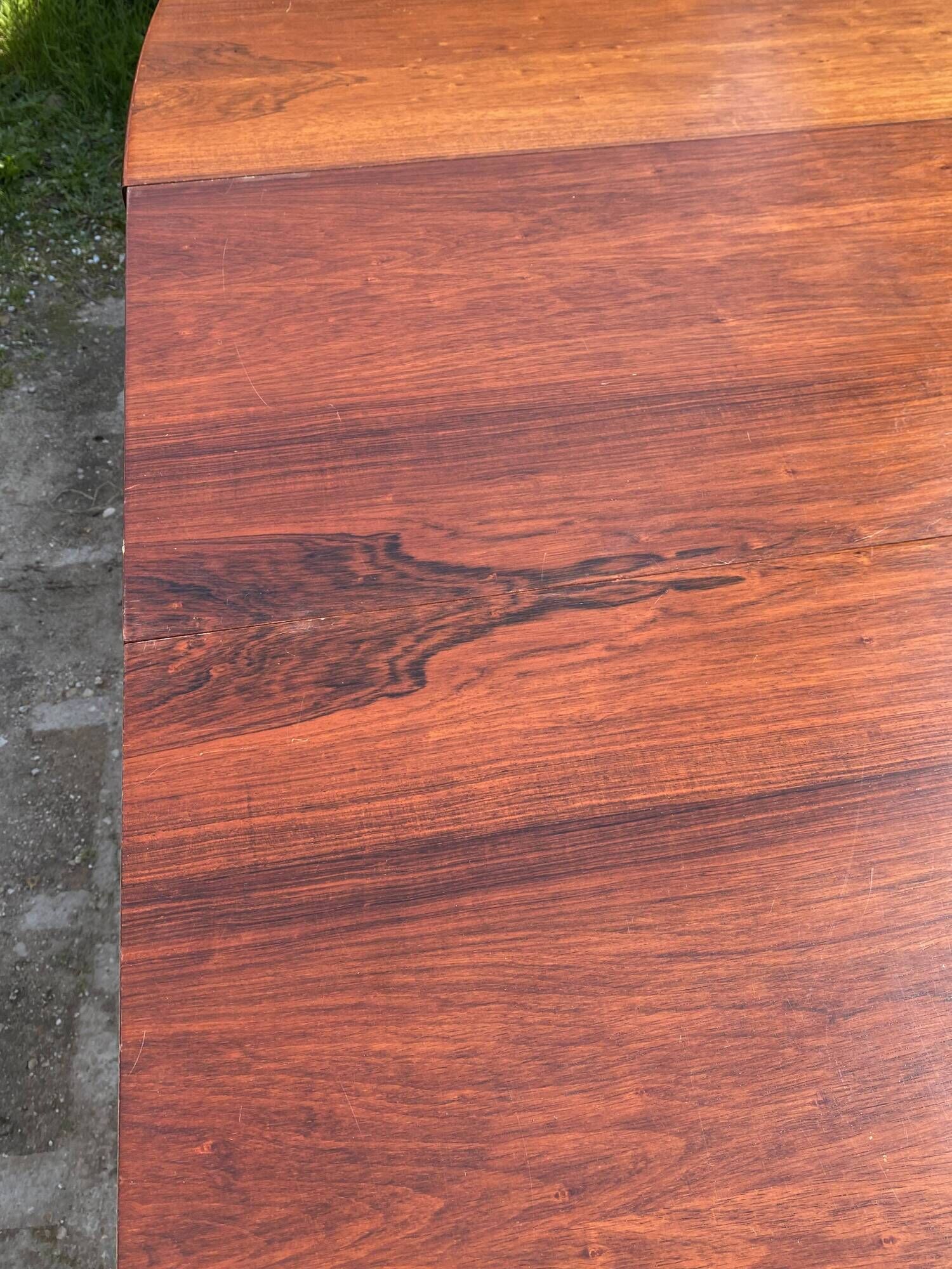 Baumann round oval extendable Scandinavian table in rosewood with 2 extensions.