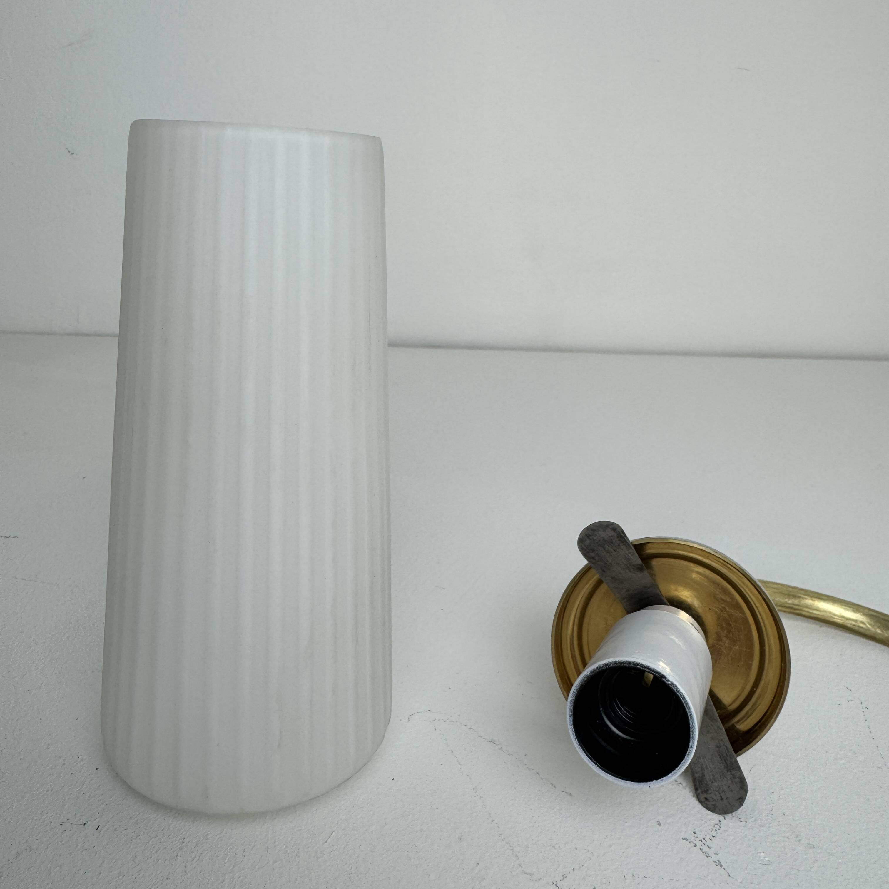 A pair of vintage opaline and brass wall lights