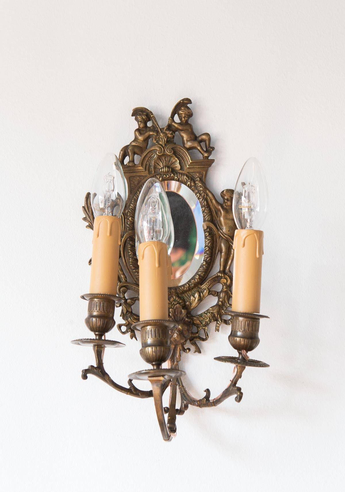 Pair of old French wall lights with beveled mirror and putti
