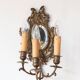 Pair of old French wall lights with beveled mirror and putti
